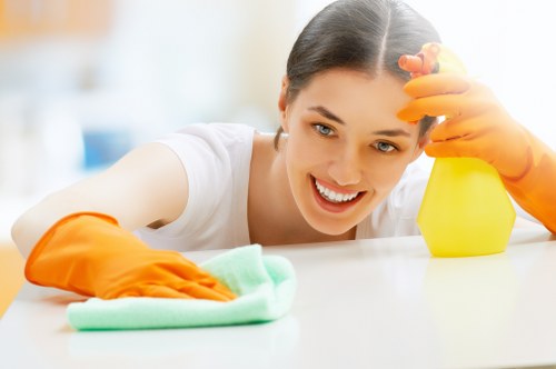 Professional stain removal service in Welling treating a carpet spill